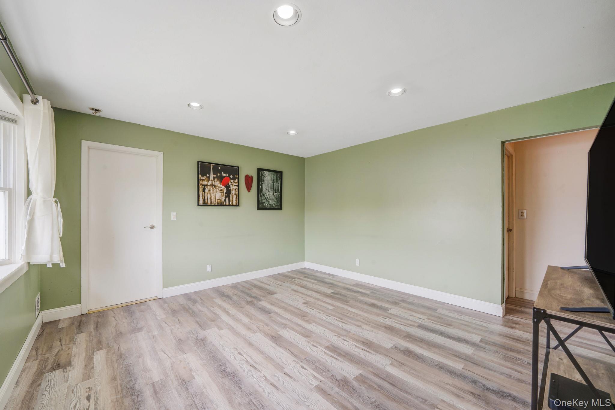 29 Franklin Street Islip, NY 11751 - Photo 5 of 39 a view of a room with wooden floor and furniture