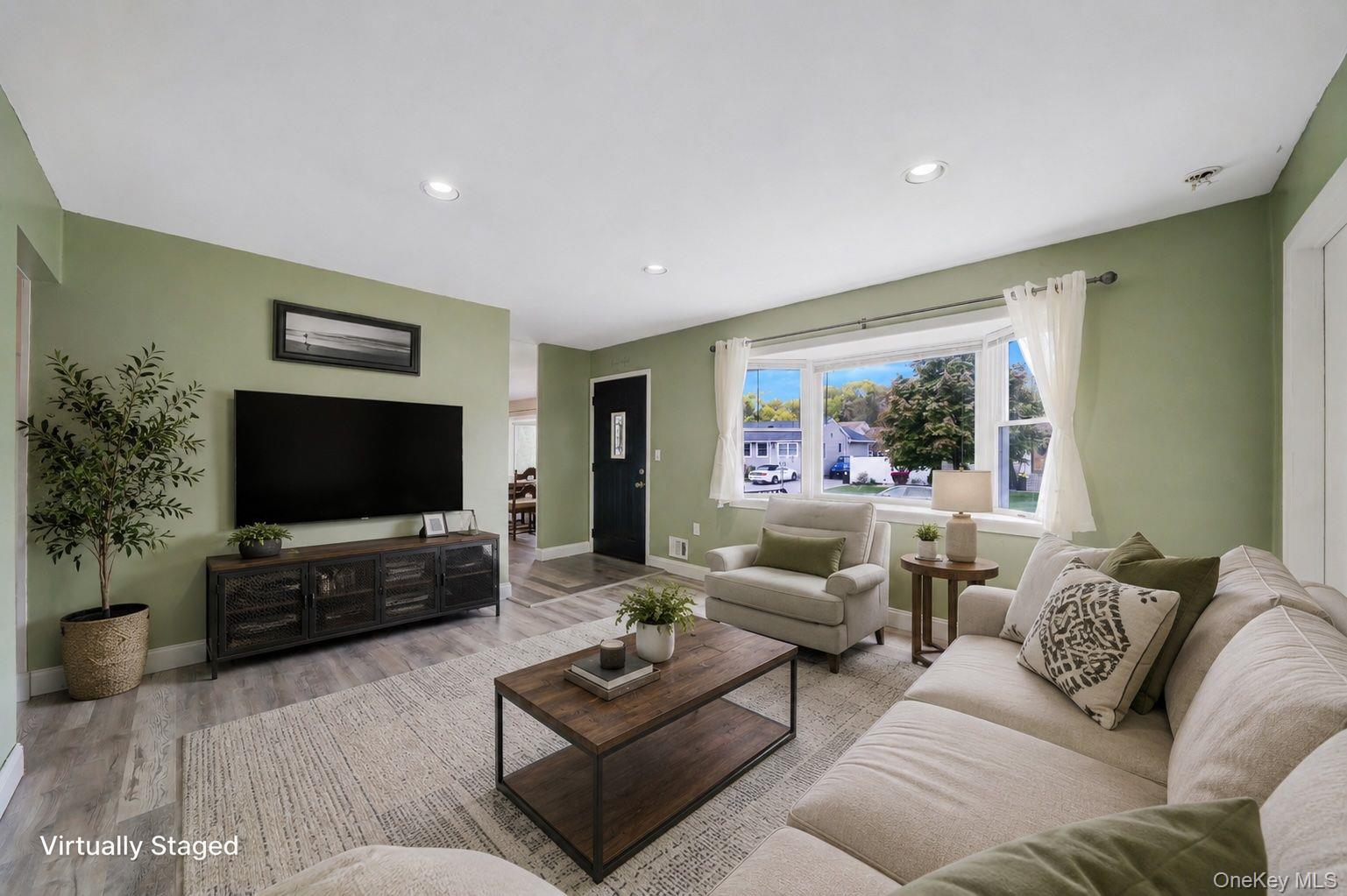 29 Franklin Street Islip, NY 11751 - Photo 10 of 39 a living room with furniture and a flat screen tv