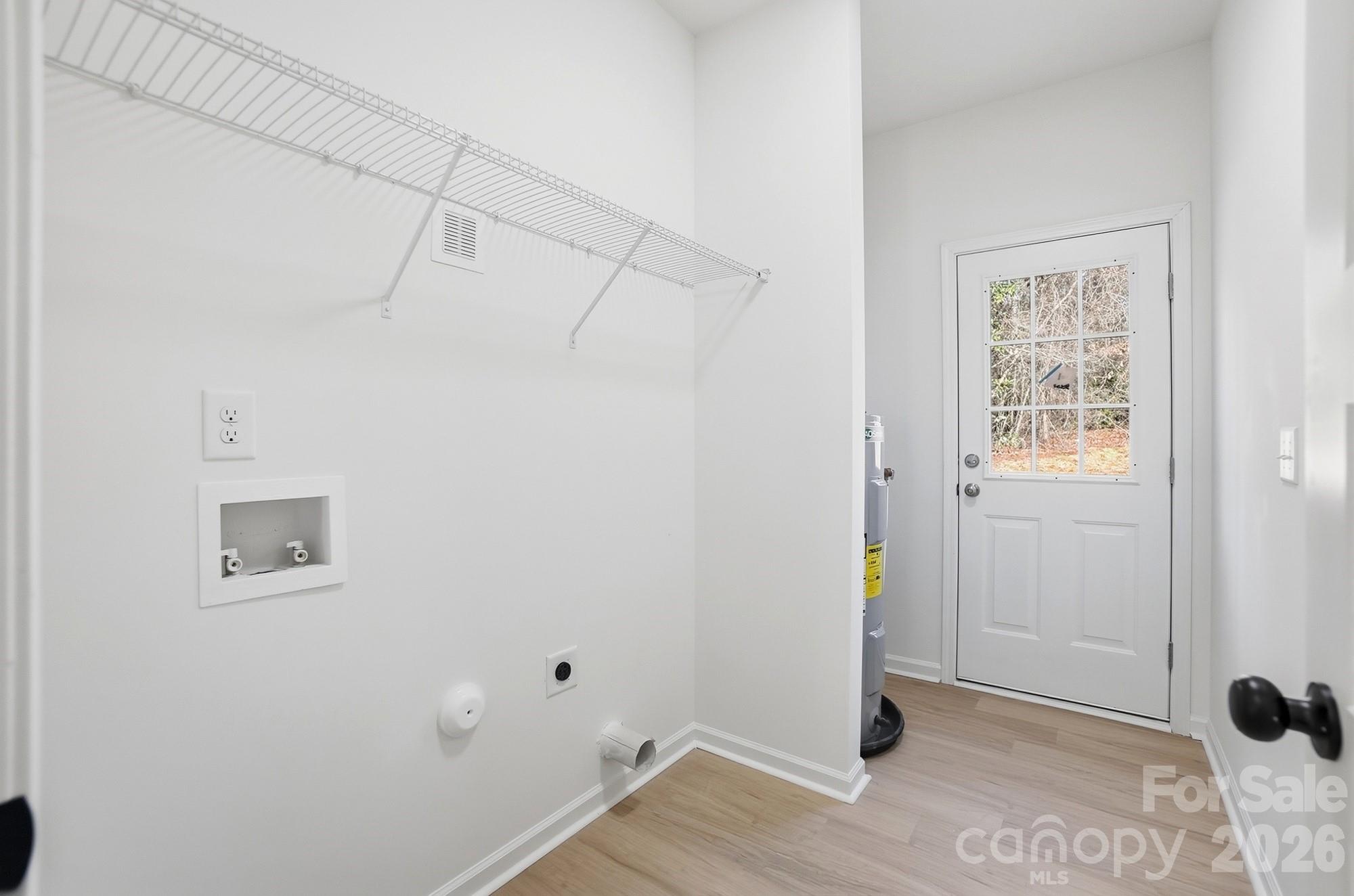 711 Adams Street Monroe, NC 28110 - Photo 24 of 25 a view of a room with wooden floor