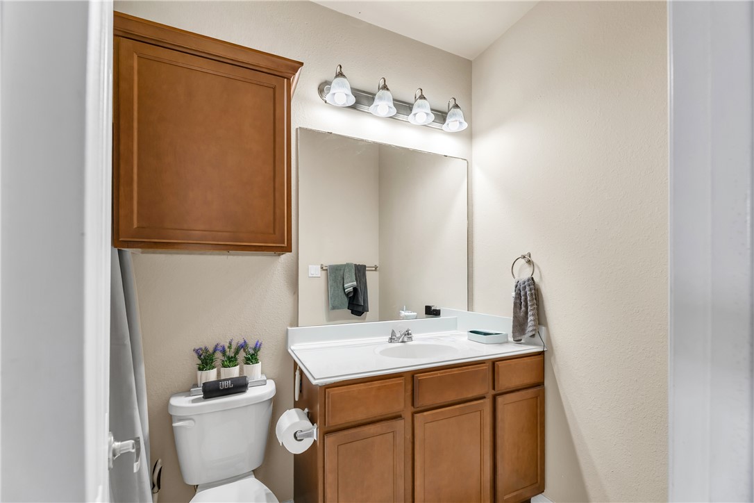 1198 Jones-Butler Road, Unit 2305 College Station, TX 77840 - Photo 16 of 25 a bathroom with a sink mirror and toilet