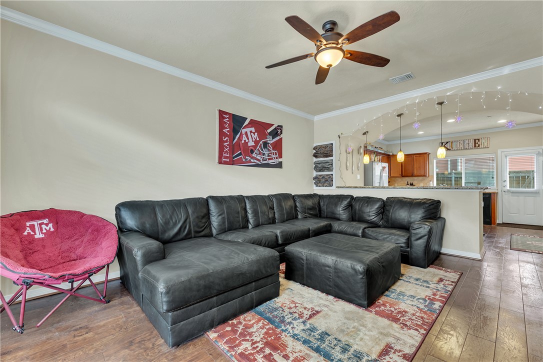 1198 Jones-Butler Road, Unit 2305 College Station, TX 77840 - Photo 3 of 25 a living room with furniture and a view of kitchen
