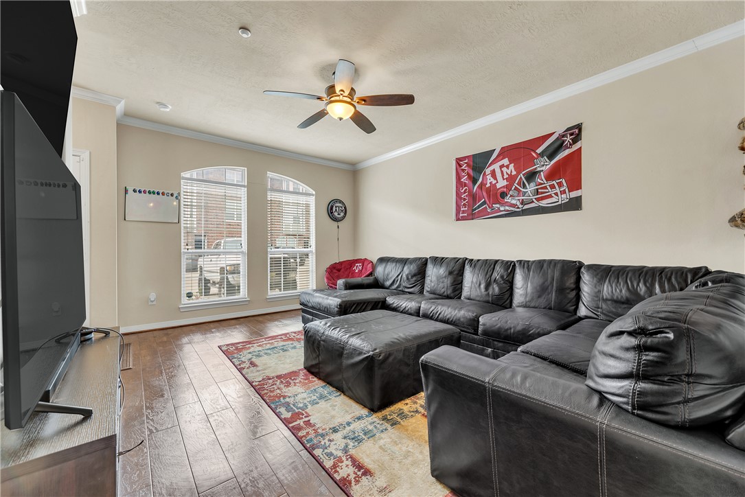 1198 Jones-Butler Road, Unit 2305 College Station, TX 77840 - Photo 4 of 25 a living room with furniture and a window