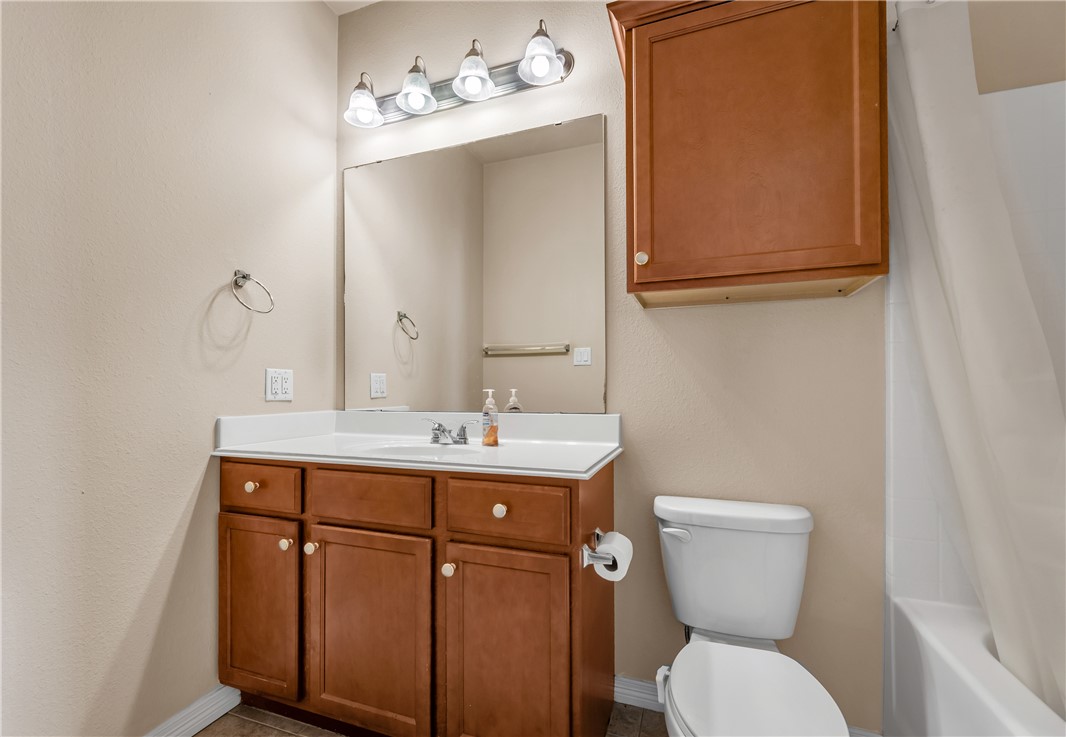 1198 Jones-Butler Road, Unit 2305 College Station, TX 77840 - Photo 10 of 25 a bathroom with a toilet a sink and mirror