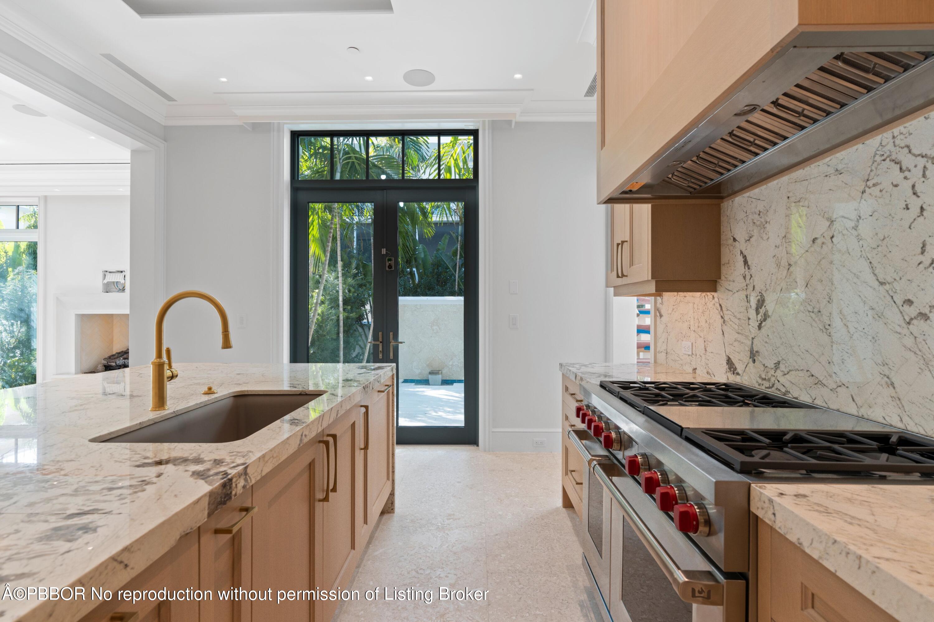 Undisclosed Address Palm Beach, FL 33480 - Photo 11 of 27 a kitchen that has a sink and a stove