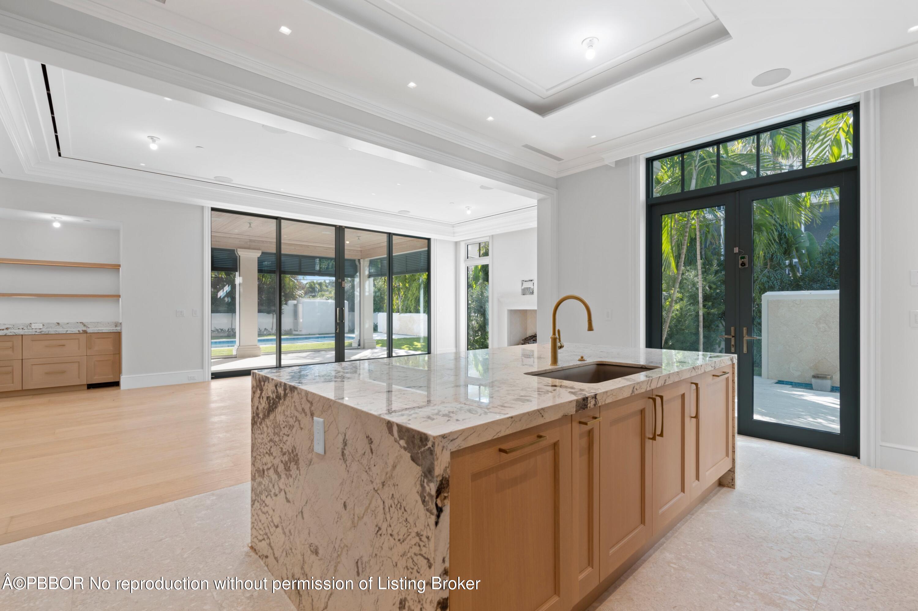 Undisclosed Address Palm Beach, FL 33480 - Photo 12 of 27 a large white kitchen with a large window