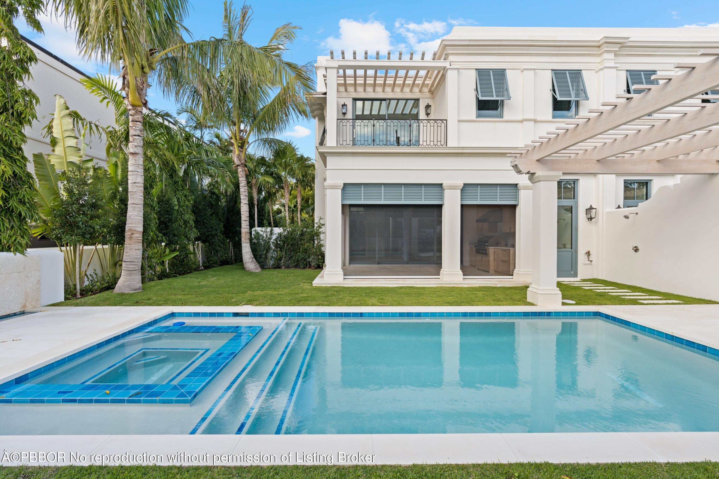 Undisclosed Address Palm Beach, FL 33480 - Photo 17 of 27 a view of a house with a swimming pool