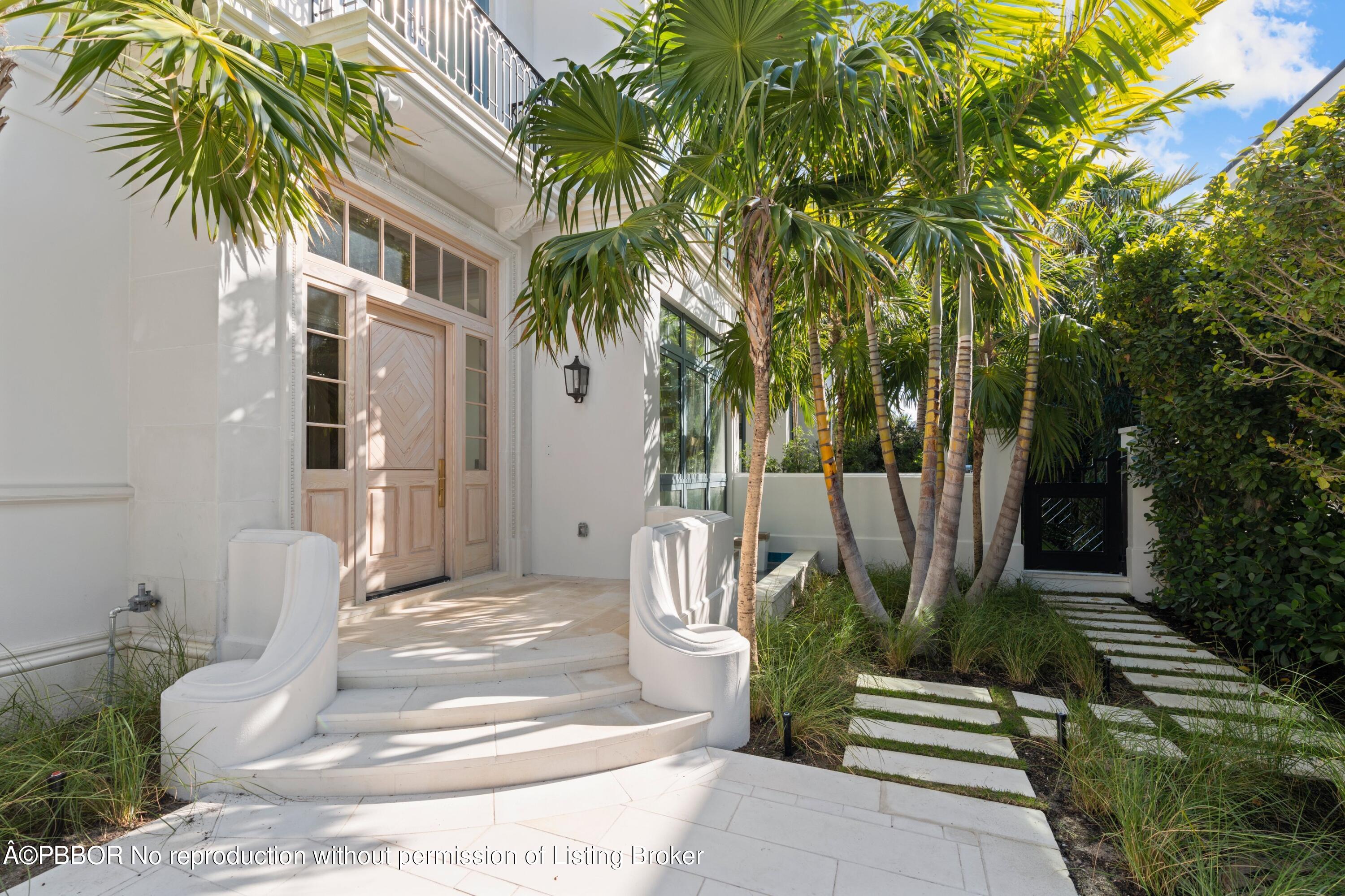 Undisclosed Address Palm Beach, FL 33480 - Photo 4 of 27 a front view of a house with garden