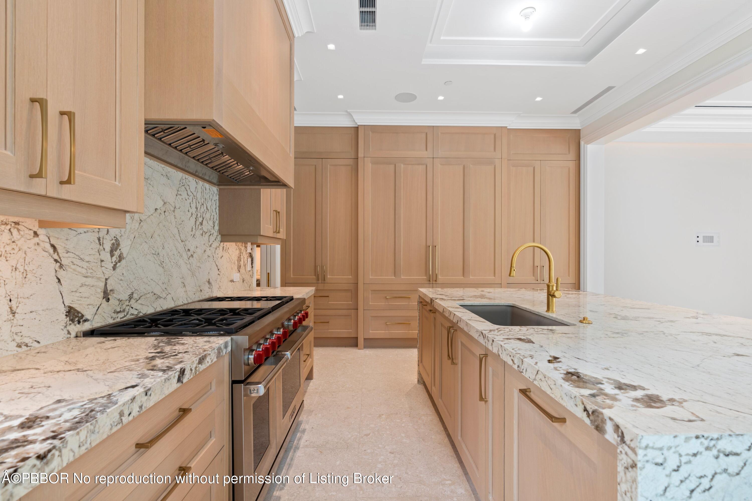 Undisclosed Address Palm Beach, FL 33480 - Photo 6 of 27 a kitchen with stainless steel appliances granite countertop a sink stove and cabinets