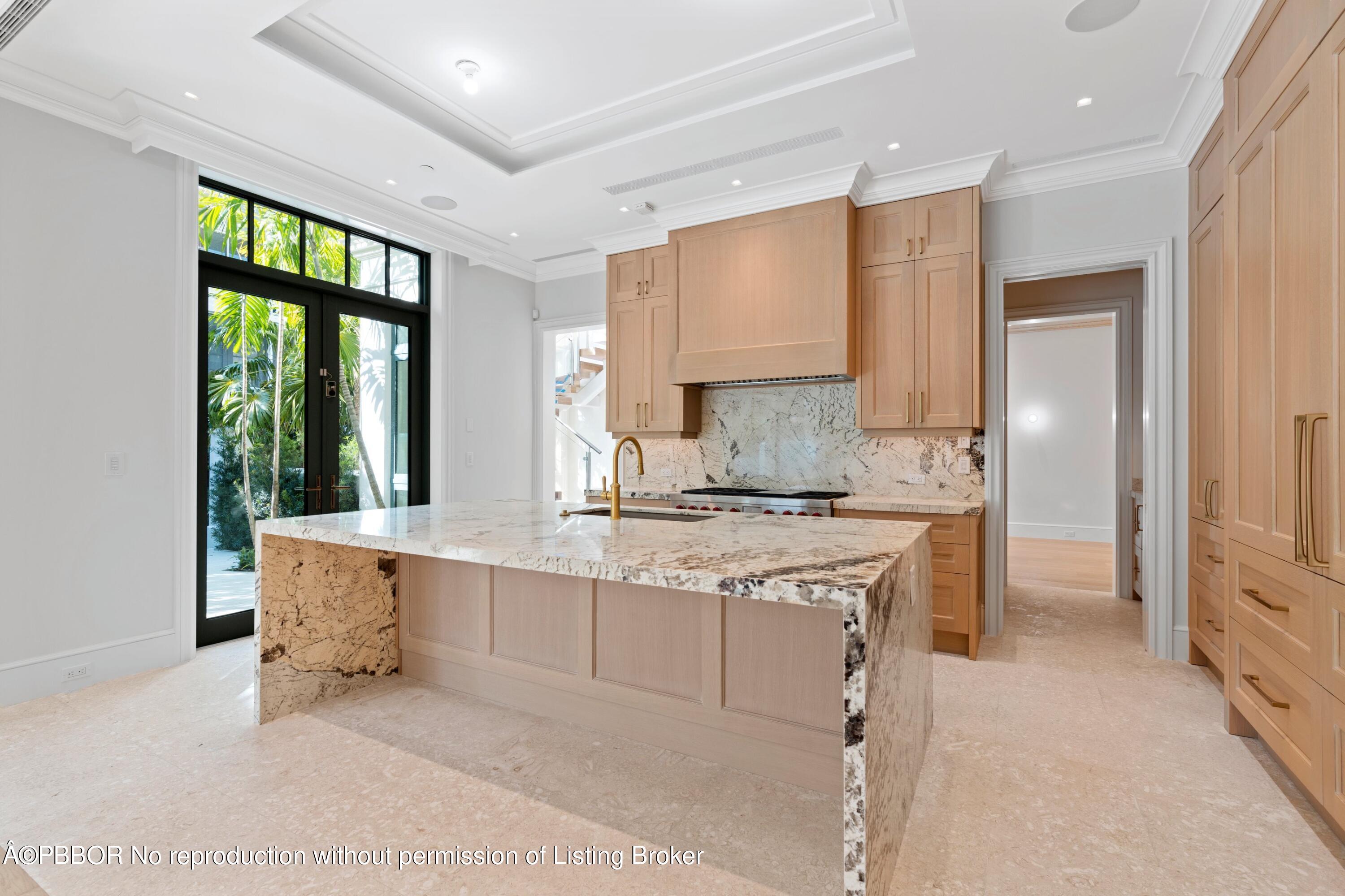 Undisclosed Address Palm Beach, FL 33480 - Photo 10 of 27 a kitchen with stainless steel appliances granite countertop a stove a sink and a refrigerator