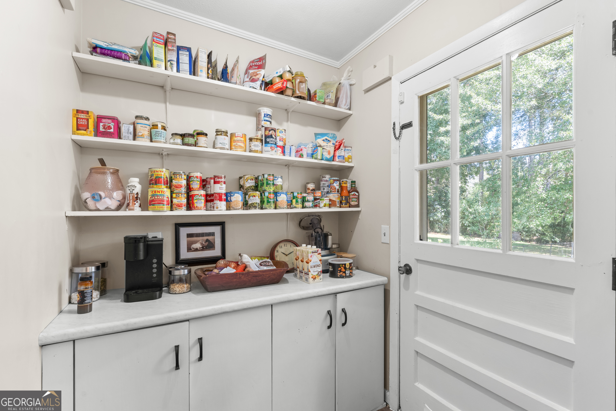313 Gentilly Road Statesboro, GA 30458 - Photo 12 of 25 a room with a book shelf and a window