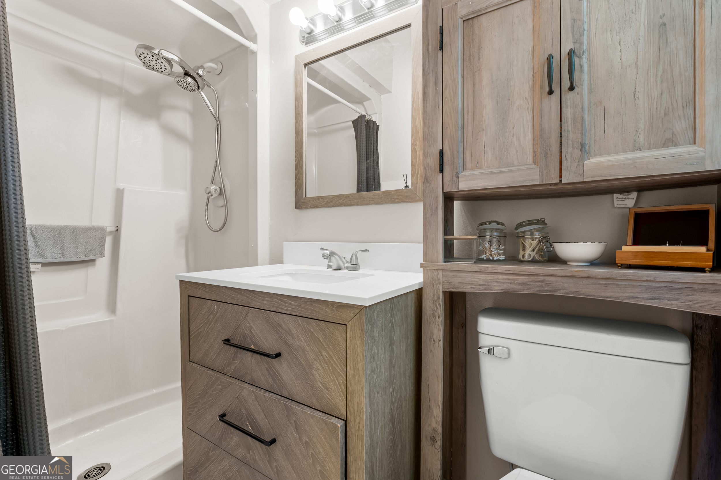 313 Gentilly Road Statesboro, GA 30458 - Photo 17 of 25 a bathroom with a sink and a mirror