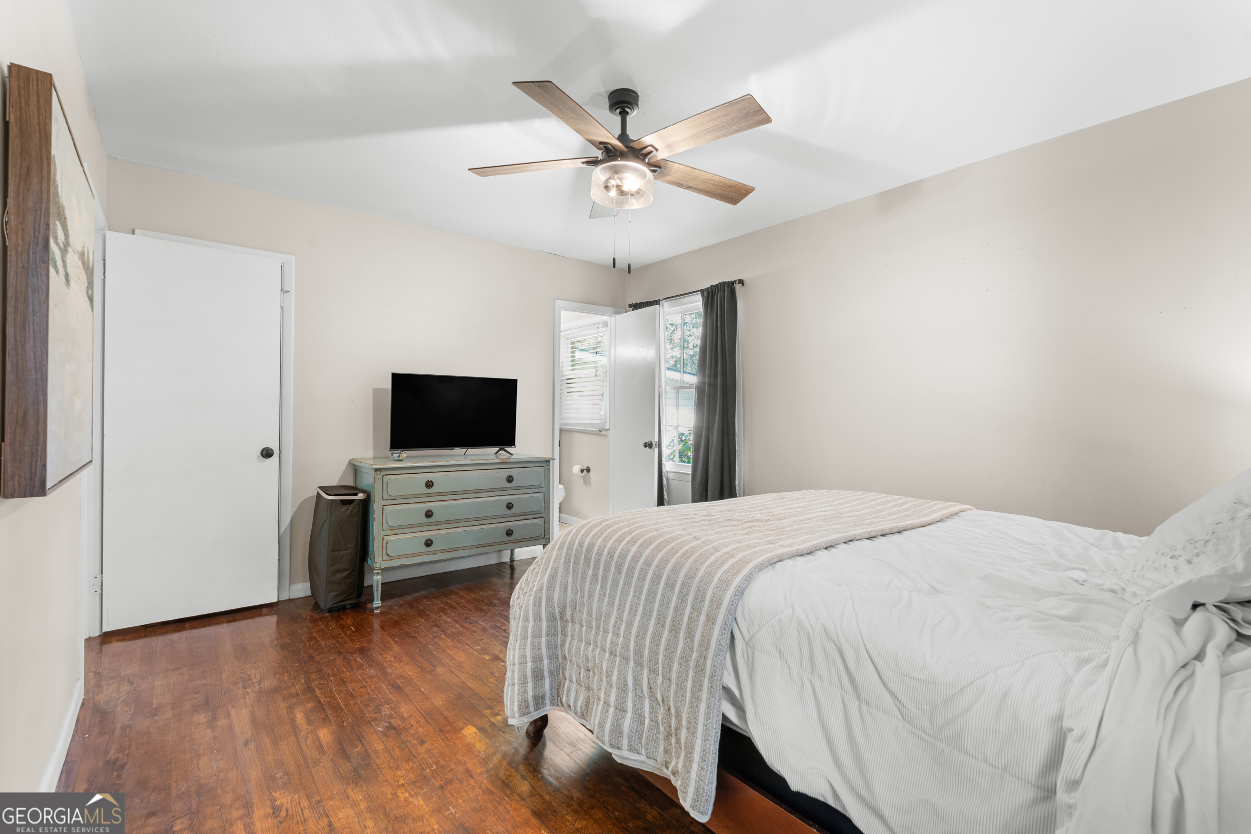 313 Gentilly Road Statesboro, GA 30458 - Photo 18 of 25 a bedroom with a bed and a flat screen tv
