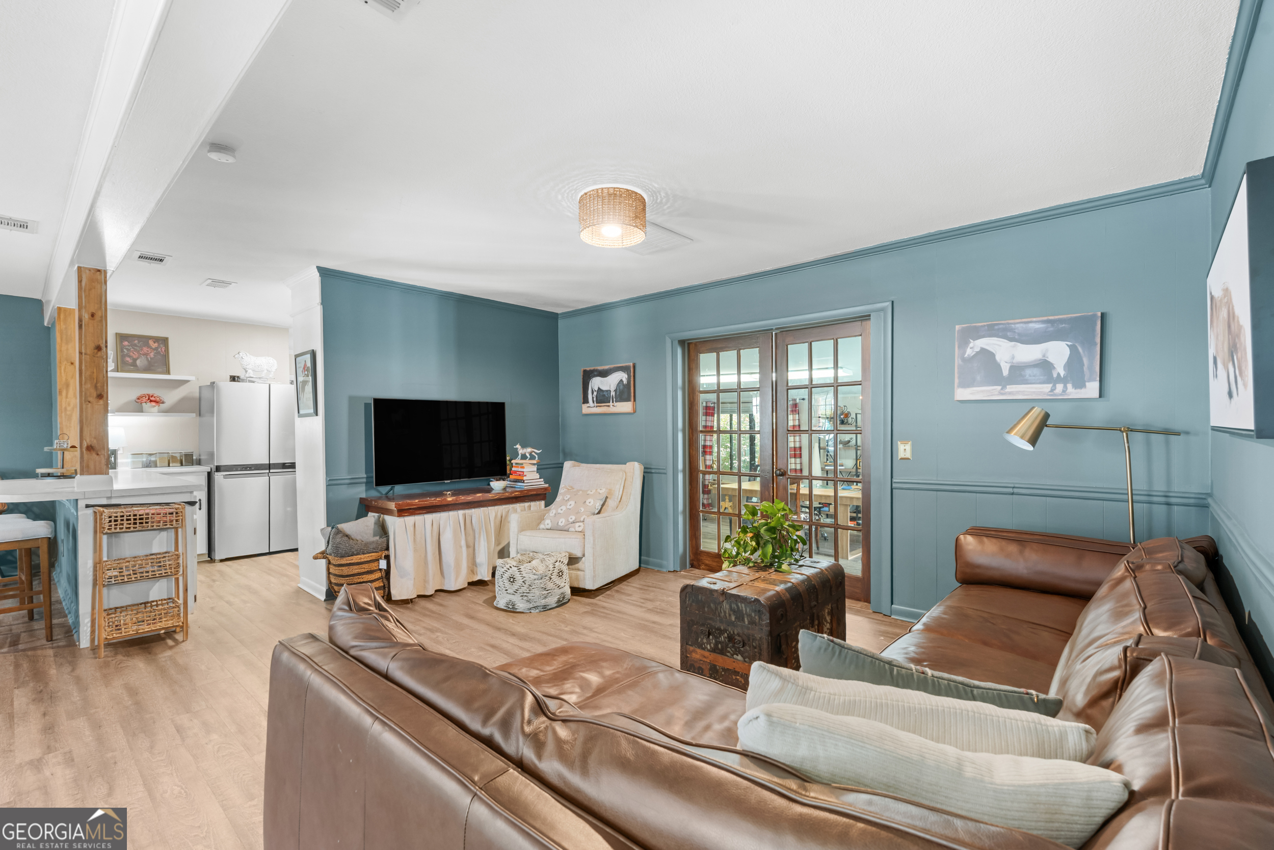 313 Gentilly Road Statesboro, GA 30458 - Photo 6 of 25 a living room with furniture and a flat screen tv
