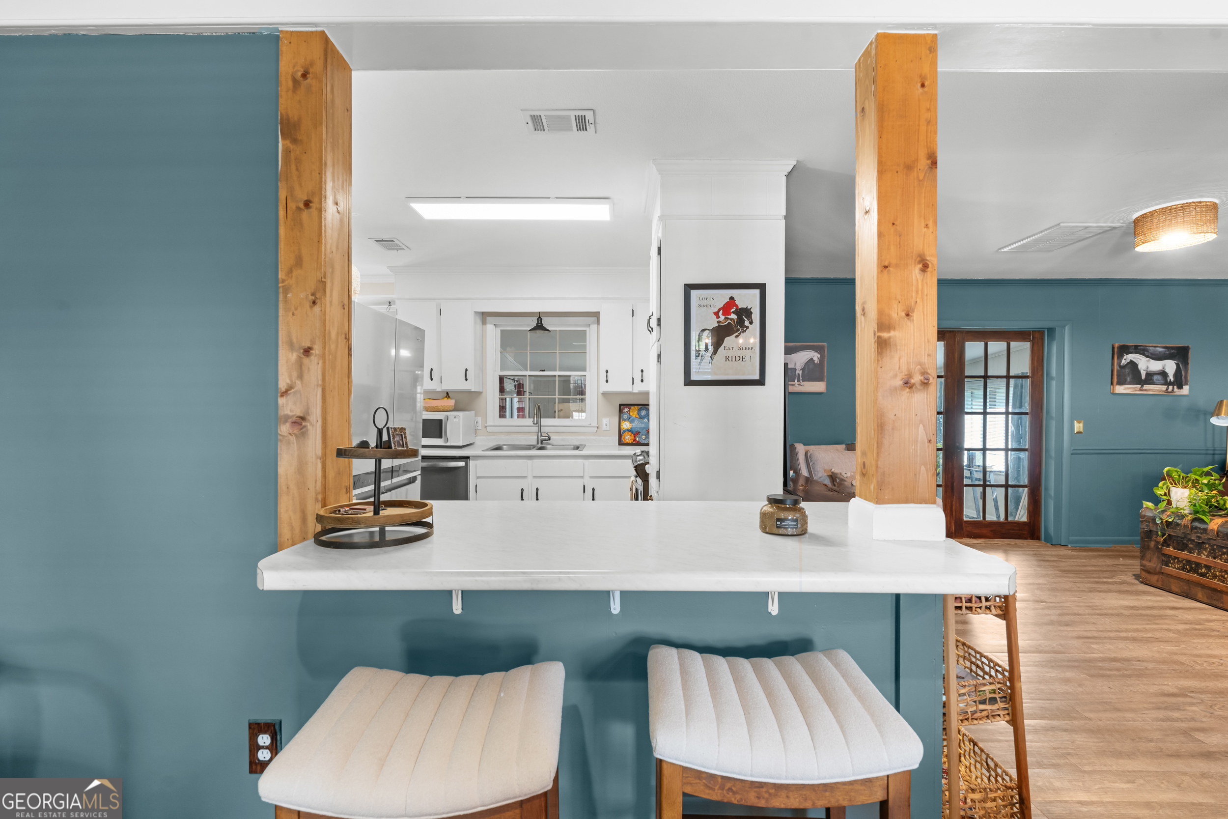 313 Gentilly Road Statesboro, GA 30458 - Photo 9 of 25 a living room with dining room and wooden floor