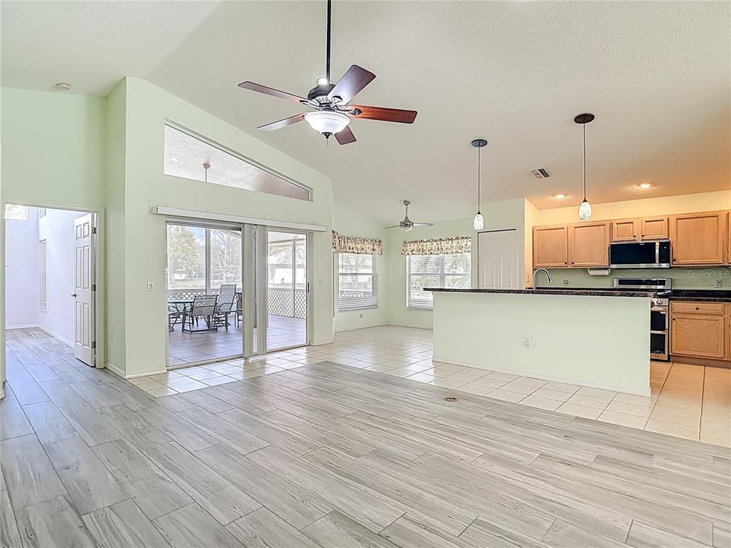 280 Quane Avenue Spring Hill, FL 34609 - Photo 24 of 62 a view of an empty room with kitchen and window