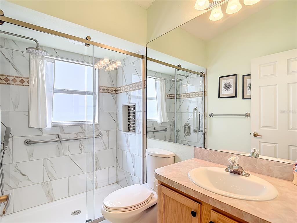 280 Quane Avenue Spring Hill, FL 34609 - Photo 40 of 62 a bathroom with a sink a toilet and shower