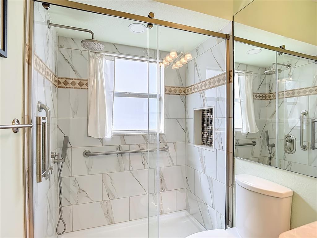 280 Quane Avenue Spring Hill, FL 34609 - Photo 41 of 62 a bathroom with a shower and a toilet