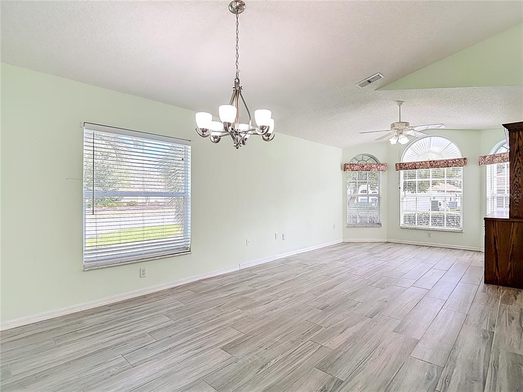 280 Quane Avenue Spring Hill, FL 34609 - Photo 10 of 62 a view of livingroom with chandelier