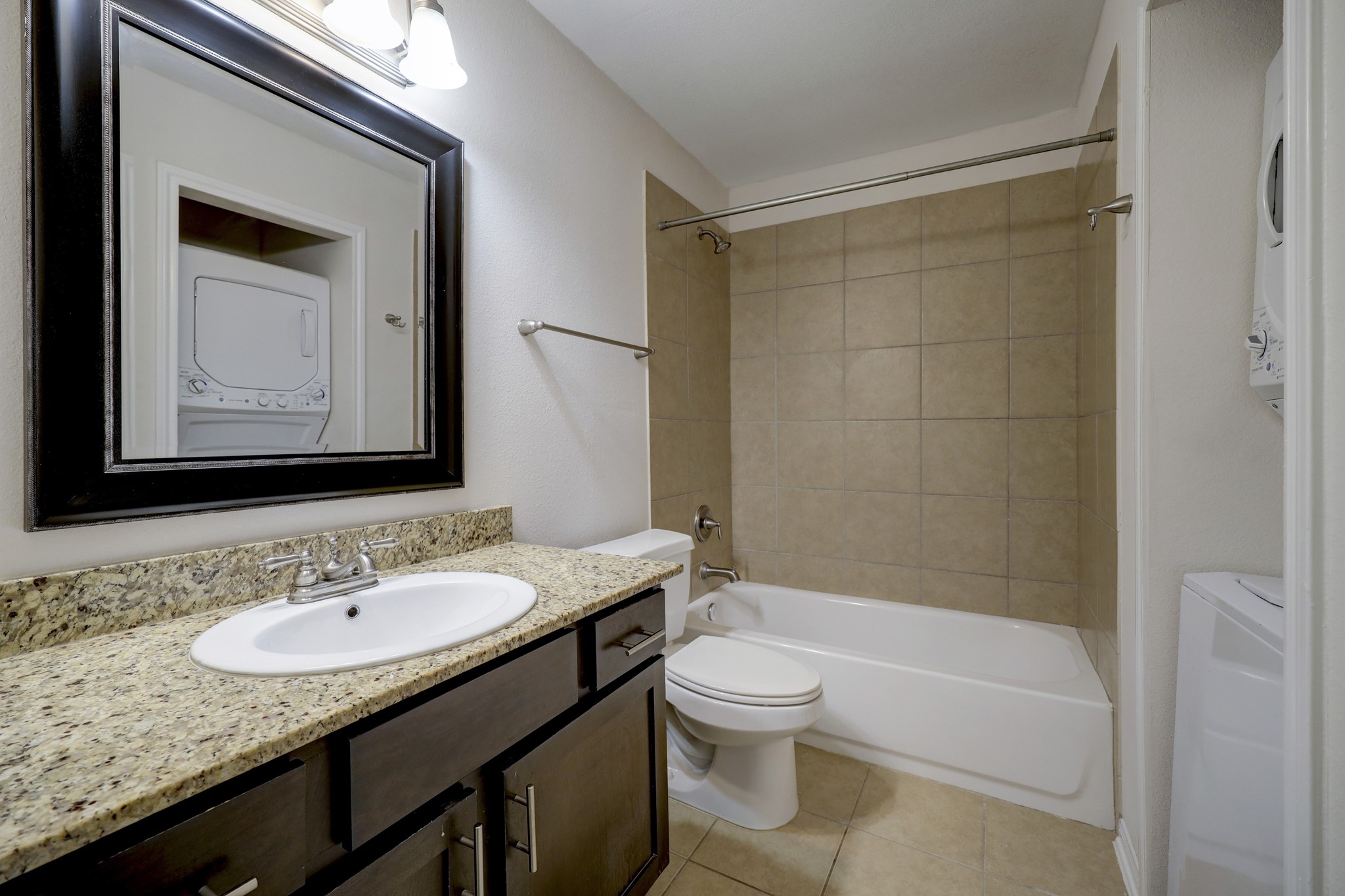 214 West 17th Street, Unit 2 Houston, TX 77008 - Photo 6 of 8 a bathroom with a granite countertop sink toilet and shower