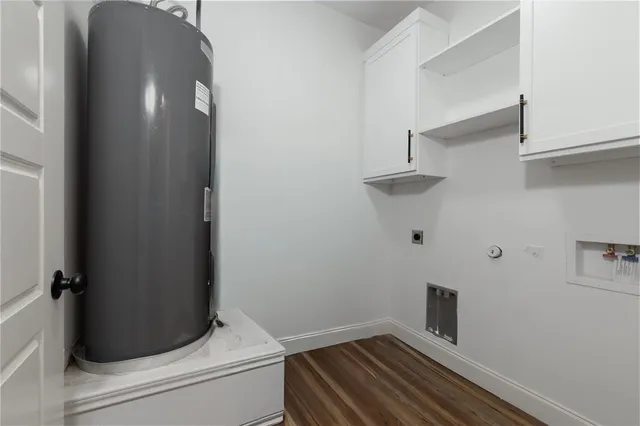 a white toilet sitting next to a bathroom sink