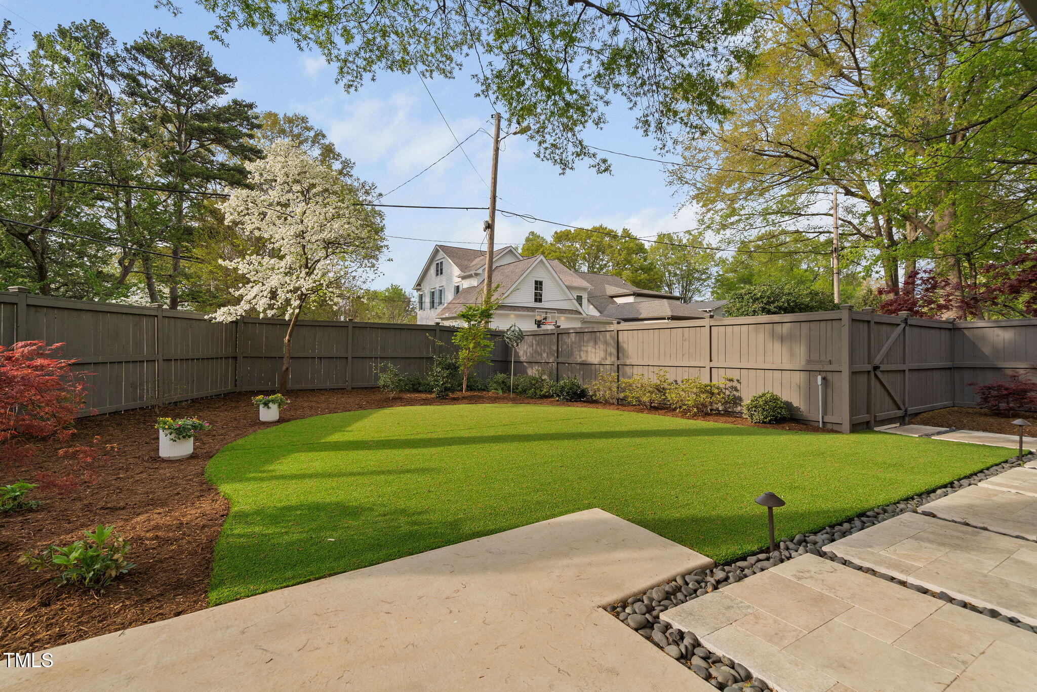 1403 Wake Forest Road Raleigh, NC 27604 - Photo 2 of 3 a view of a backyard with wooden fence