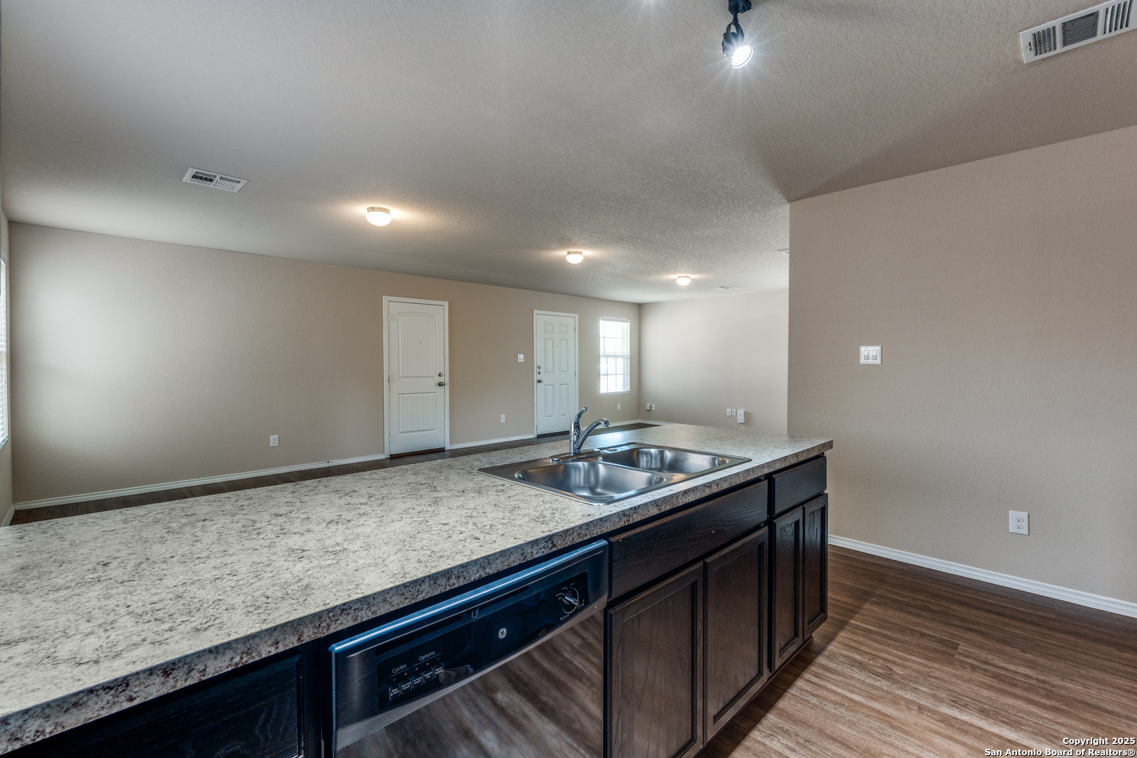 5102 Everett Loop Converse, TX 78109 - Photo 11 of 24 a kitchen with a sink and cabinets