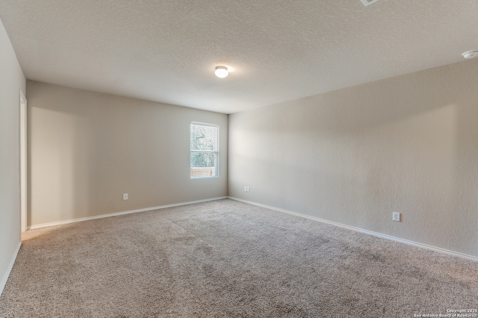 5102 Everett Loop Converse, TX 78109 - Photo 12 of 24 a view of an empty room and a window