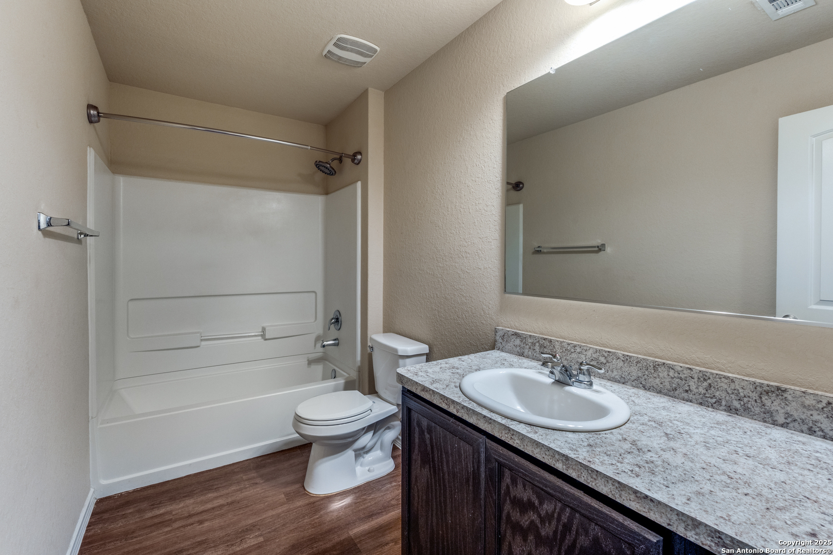 5102 Everett Loop Converse, TX 78109 - Photo 18 of 24 a bathroom with a granite countertop sink toilet and shower