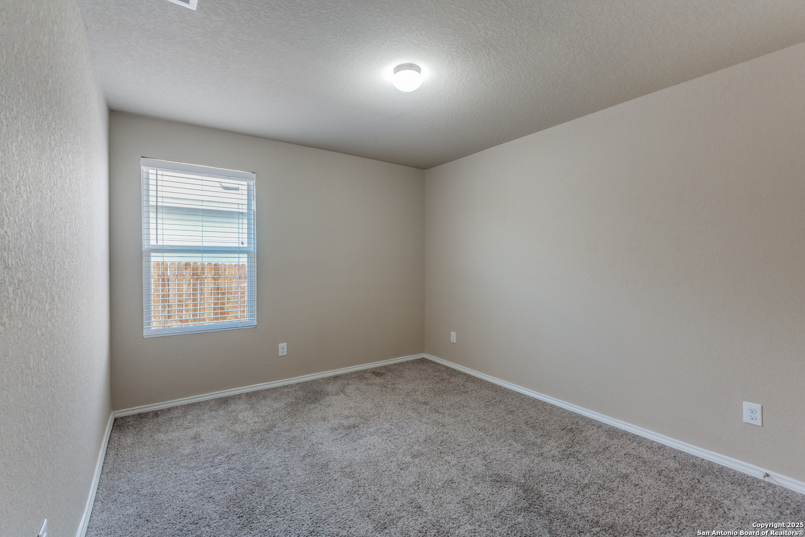 5102 Everett Loop Converse, TX 78109 - Photo 19 of 24 an empty room with a window