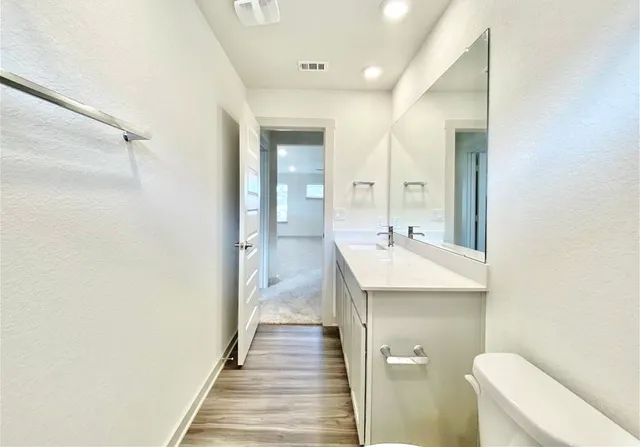 a view of an entryway with wooden floor