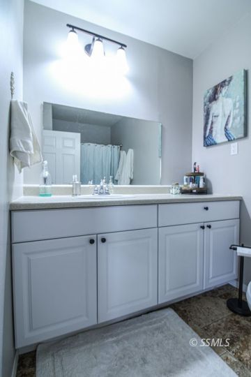 708 West Perdew Avenue Ridgecrest, CA 93555 - Photo 26 of 37 a bathroom with a sink and a mirror