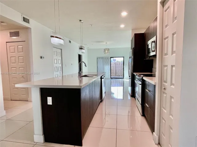 a large kitchen with cabinets