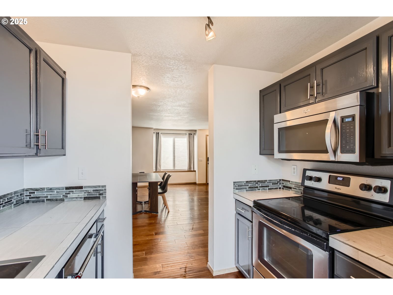2501 East 2nd Street Newberg, OR 97132 - Photo 4 of 18 a kitchen with a stove and a microwave