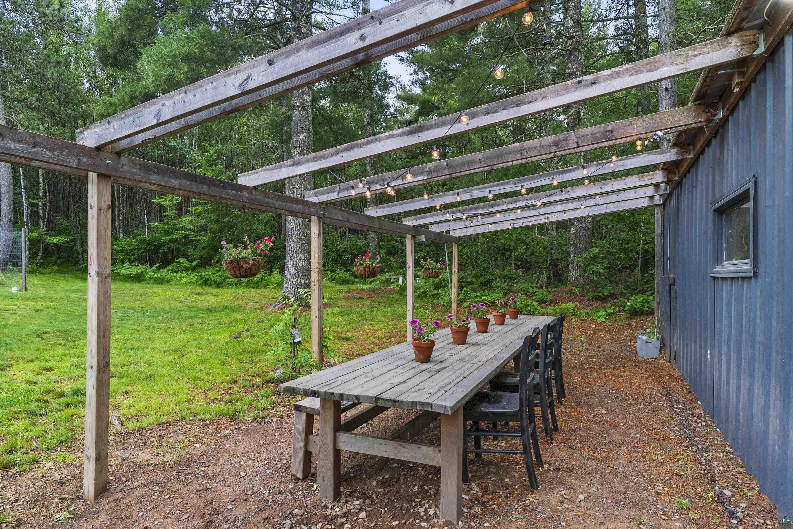 6345 Smith Lake Road Barnes, WI 54873 - Photo 41 of 50 View of yard with a pergola