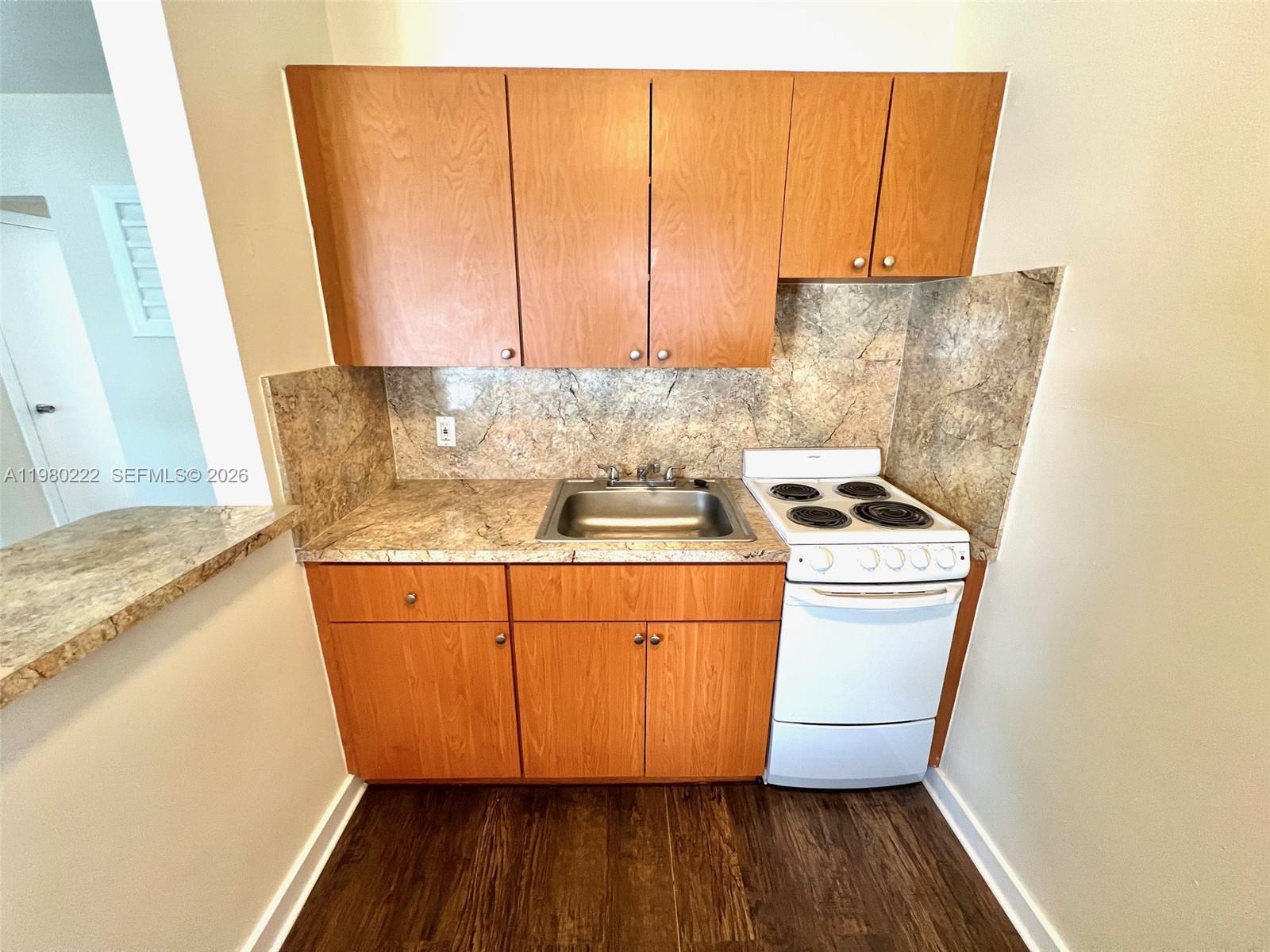 692 Northeast 85th Street, Unit 6 Miami, FL 33138 - Photo 3 of 6 a room with storage and utility