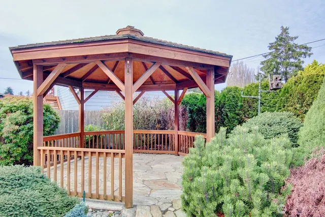 a view of a wooden deck with a backyard