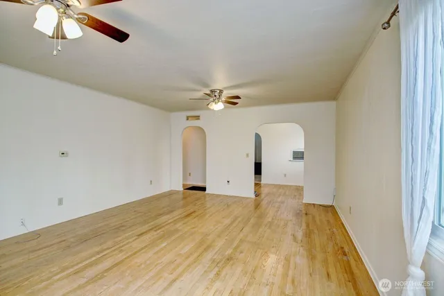 a view of a room with wooden floor
