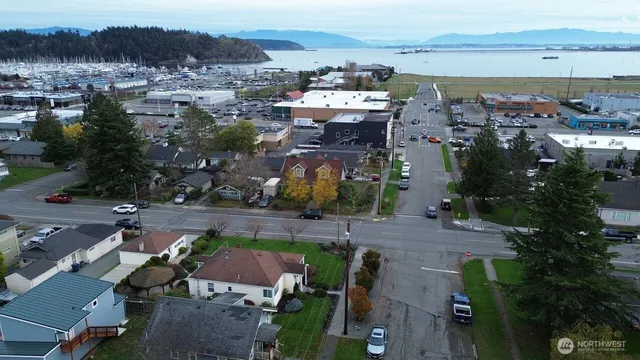 an aerial view of a house with a lake view