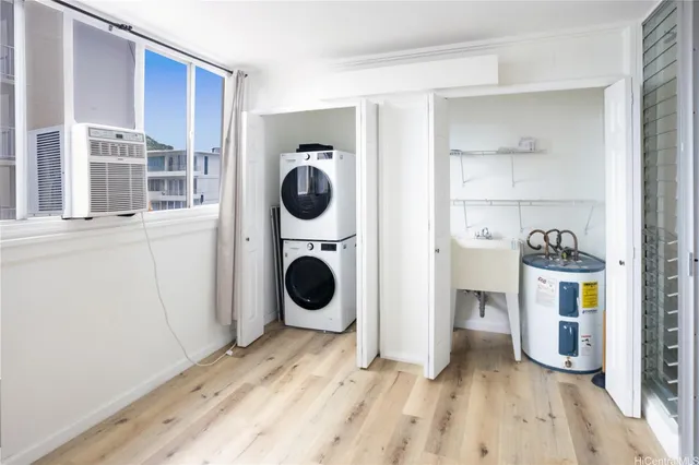 a view of a kitchen with a washer and dryer