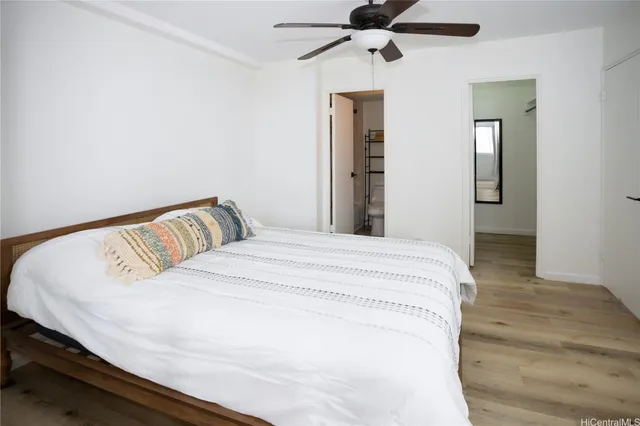 a large white bed in a white room