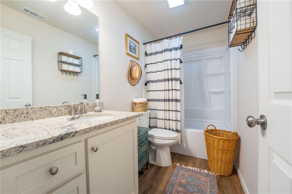 118 Wash Rider Road Dahlonega, GA 30533 - Photo 8 of 37 a bathroom with a granite countertop sink toilet and shower