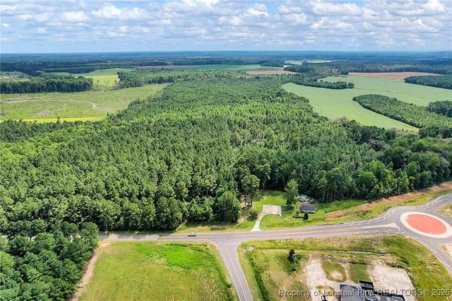 a view of a swimming pool with a yard