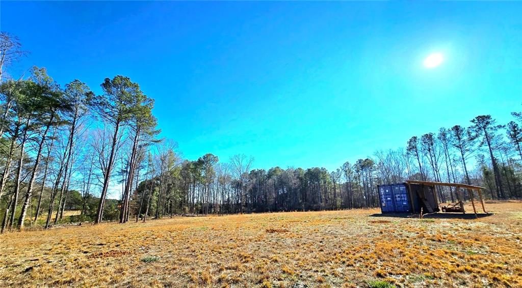 68 Lowery Rd S West Kingston, GA 30145 - Photo 4 of 14 a view of a yard with a house
