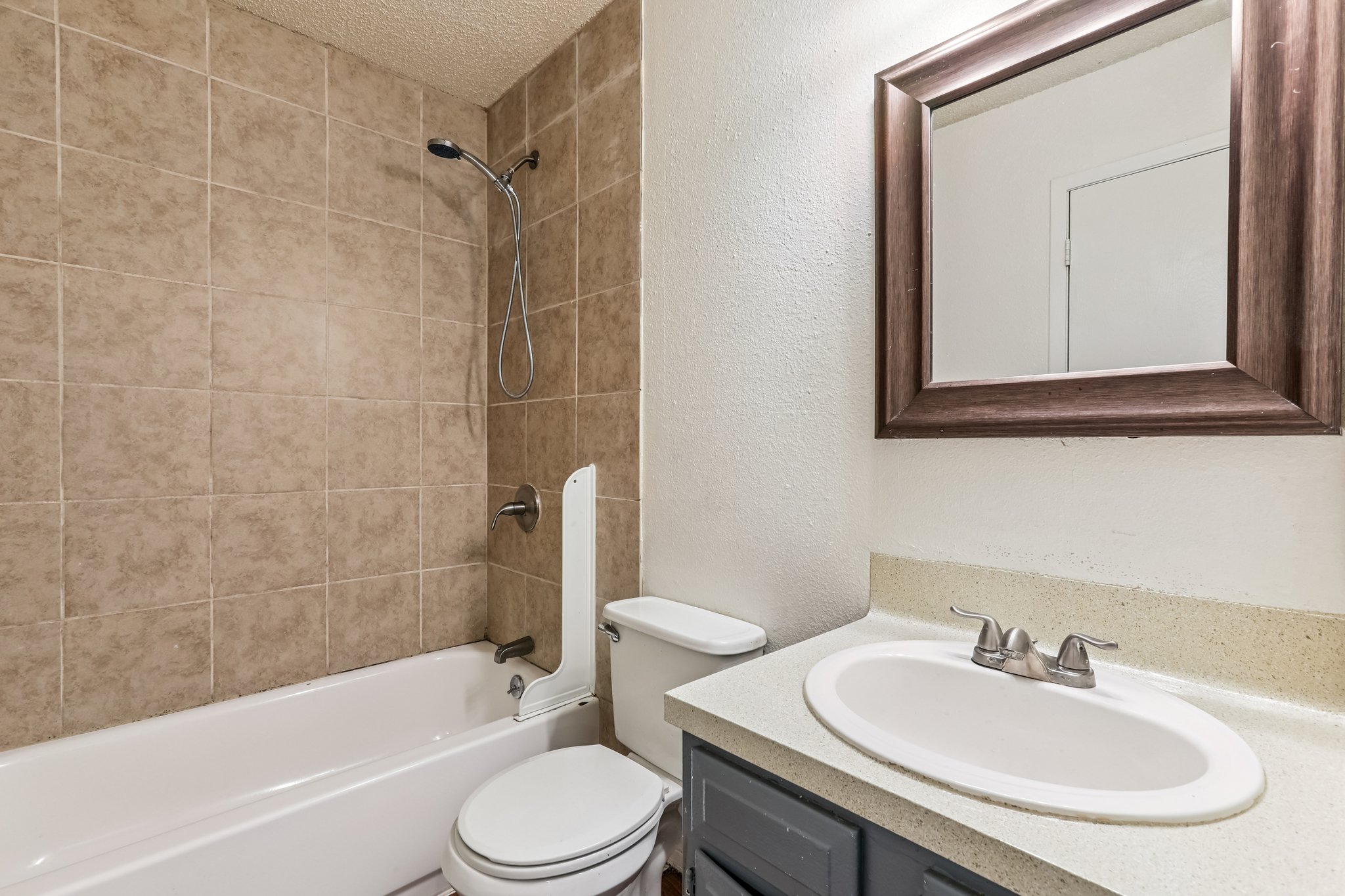 5000 Weidemar Lane, Unit C Austin, TX 78745 - Photo 7 of 8 a bathroom with a sink toilet and shower