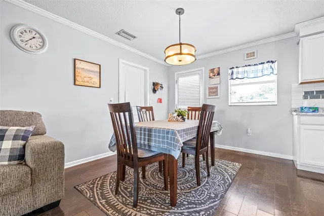 a view of a dining room with furniture