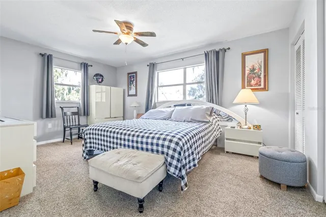 a bedroom with a bed and a couch