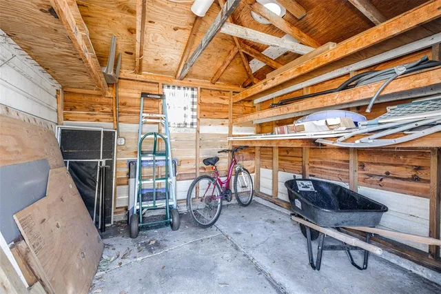 a view of a storage room with a table and chairs