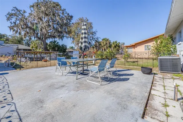 a view of a patio with swimming pool