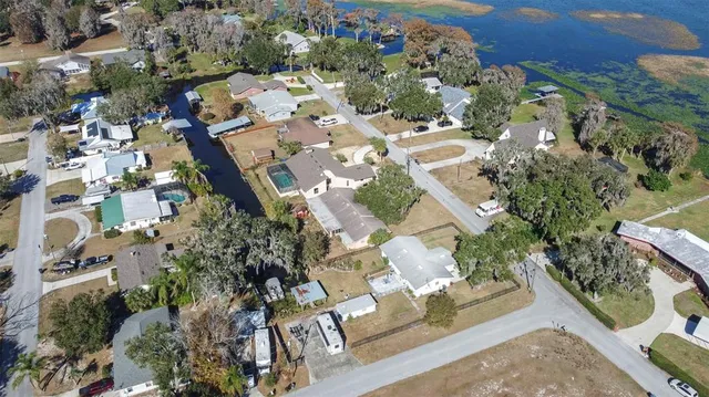 an aerial view of residential houses with outdoor space
