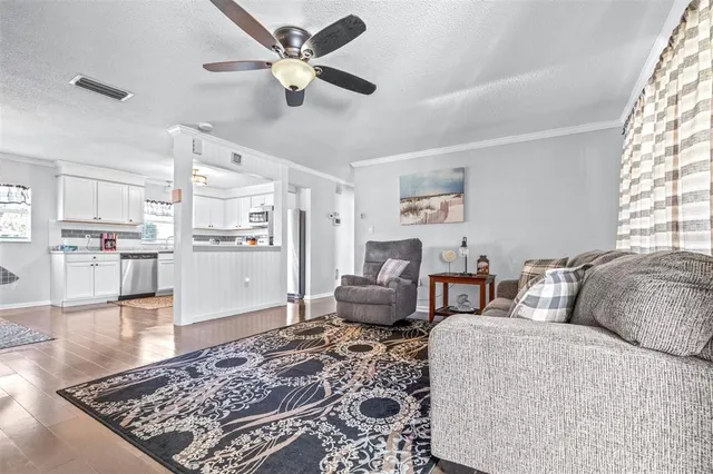 a living room with furniture and a rug